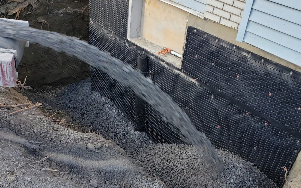 Adding Gravel to Repaired and Waterproofed Foundation