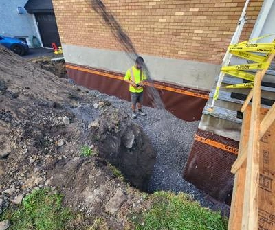 Exterior basement waterproofing and drainage system installation