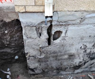 Severely cracked concrete foundation